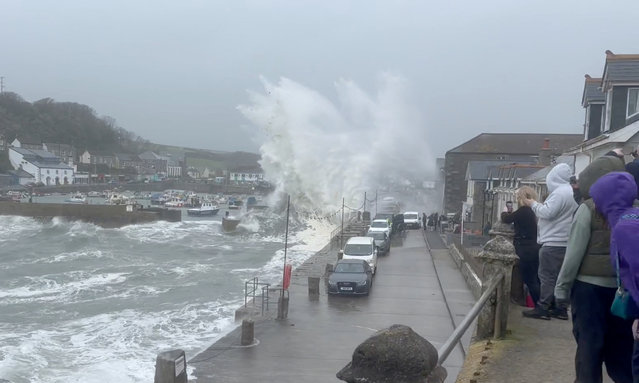 People watch in Porthleven, UK on April 6, 2024 strong waves as Storm Kathleen brought high winds and flooding to parts of the country. (Photo by Jo-Shreeve/Reuters)