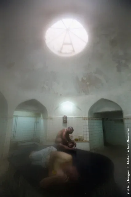 Iraqis relax in a hamam, or Turkish bath