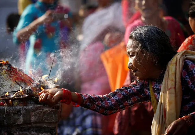 A devotee offers prayers at Matathirtha to commemorate her departed mother during Mother's Day in Kathmandu, Nepal, May 6, 2016. (Photo by Navesh Chitrakar/Reuters)