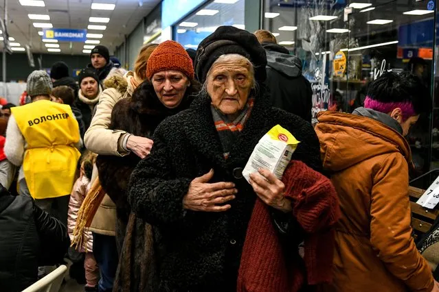 Nearly 200 buses arrive from Berdyansk evacuating over thousand people due to ongoing Russian attacks in Zaporizzja, Ukraine on March 22, 2022. After reaching the Zaporizzja city, they received food and they are transferred to temporary shelters after registration. (Photo by Stringer/Anadolu Agency via Getty Images)