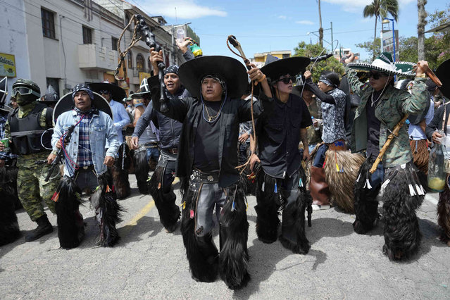 People dance in honor of the Indigenous Incan sun god in hopes of being granted a plentiful harvest during the Inti Raymi, or Sun Festival, at the Plaza de Cotacachi, Ecuador, Monday, June 24, 2024. (Photo by Dolores Ochoa/AP Photo)