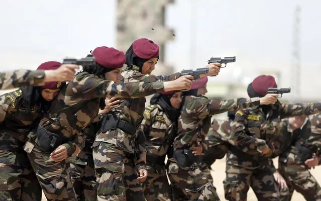 Female members of the Palestinian presidential guard take part in a training session given by French GIGN gendarme in the West Bank city of Jericho on May 12, 2014. (Photo by Thomas Coex/AFP Photo)