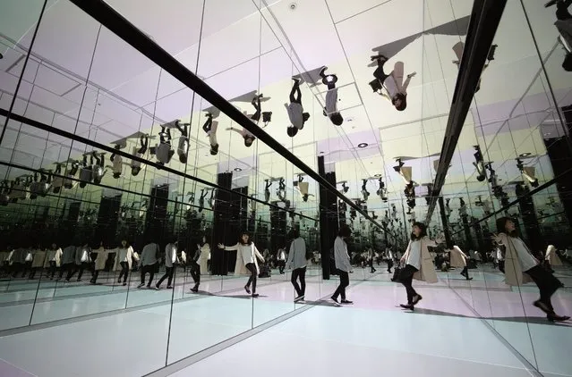 Visitors walk through a kaleidoscopic  installation in the Sky Circus, an observatory on top of the Sunshine 60 building in Tokyo, Japan, 22 April 2016. The newly renovated observatory opened to the public on 21 April 2016. The Sunshine 60 building is 240 m tall, and was the tallest building in Japan for nearly a decade and was the tallest in Asia until 1985, after the completion of the 63 Building in Seoul, South Korea. (Photo by Franck Robichon/EPA)
