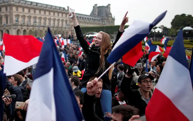 Supporters of Emmanuel Macron celebrate near the Louvre museum after results were announced in the second round vote of the 2017 French presidential elections, in Paris, France May 7, 2017. (Photo by Benoit Tessier/Reuters)