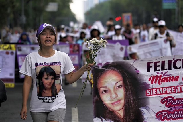 Vania Hernandez Portillo, whose mother is disappeared, joins mothers of disappeared children in a march to demand government help in the search for their missing loved ones, on Mother's Day in Mexico City, Wednesday, May 10, 2023. (Photo by Marco Ugarte/AP Photo)