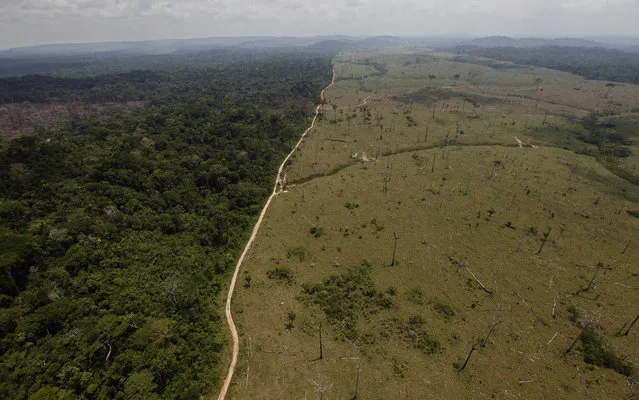 This September 15, 2009 file photo shows a deforested area near Novo Progresso in Brazil's northern state of Para. Brazilian President Michel Temer vetoed legislation that would have reduced the size of the country’s protected environmental reserves, most of them in the Amazon. Temer tweeted the news of his vetoes on Monday, June 19, 2017, in exchanges with supermodel Gisele Bundchen after she implored him to “protect mother earth” and veto the bills, which would have converted 1.4 million acres of protected land into areas open to logging, mining and farming. But the apparent win for environmental groups may be short-lived. (Photo by Andre Penner/AP Photo)