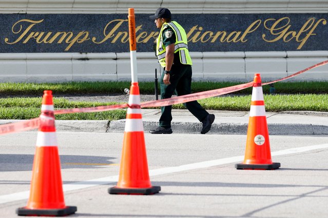 A law enforcement officer walks after reports of shots fired outside Republican presidential nominee and former U.S. President Donald Trump's Trump International Golf Course in West Palm Beach, Florida, U.S. September 15, 2024. (Photo by Marco Bello/Reuters)