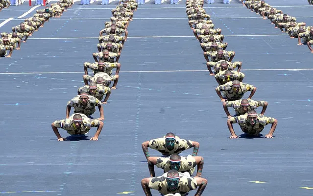 Military students display their training to mark the opening of the Mohamed Najib military base, the graduation of new graduates from military colleges, and the celebration of the 65th anniversary of the July 23 revolution at El Hammam City in the North Coast, in Marsa Matrouh, Egypt, July 22, 2017 in this handout picture courtesy of the Egyptian Presidency. (Photo by Reuters/The Egyptian Presidency)
