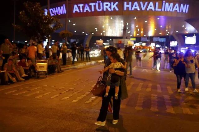People leave Turkey's largest airport, Istanbul Ataturk, Turkey, following a blast June 28, 2016. (Photo by Osman Orsal/Reuters)
