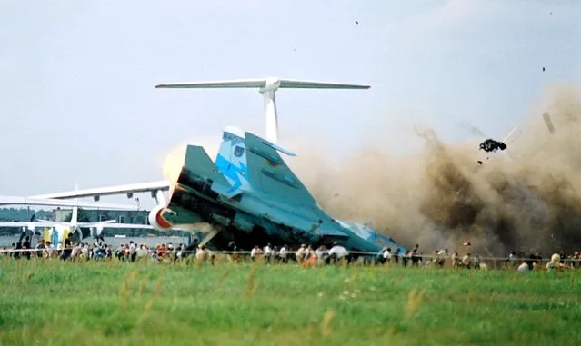 A SU-27 plane crashing into spectators during an air show in Lviv, Ukraine, 27 July 2002. According to officials, 199 people were injured and 83 died including 15 children. More than 1,000 Ukrainians gathered at the airfield outside the western city of Lviv to attend a memorial service for those who died and were injured in the weekend air show disaster. (Photo by EPA/EFE)