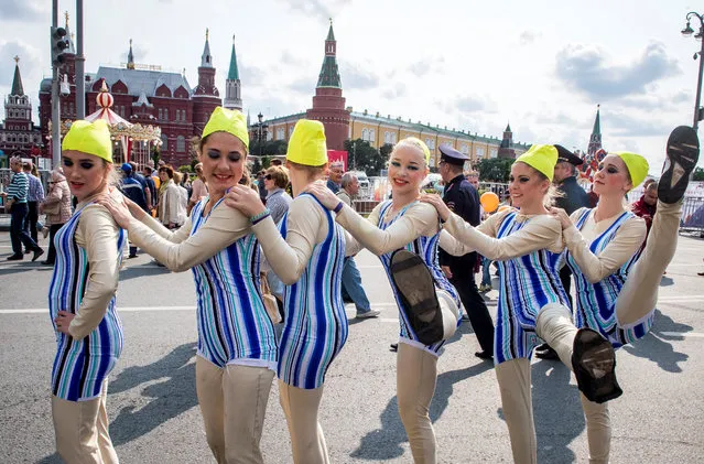 Dancers perform during celebrations of the 870th anniversary of the city in downtown Moscow on September 10, 2017. (Photo by Mladen Antonov/AFP Photo)