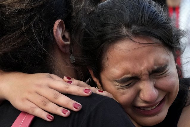 A woman from the Palestinian community cries during a protest in support of the Palestinian people outside the National Museum in Brasilia, Brazil, Tuesday, October 10, 2023. (Photo by Eraldo Peres/AP Photo)