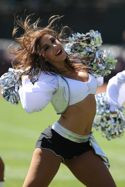 September 15, 2013; Oakland, CA, USA; Oakland Raiders cheerleader performs during the first quarter against the Jacksonville Jaguars at O.co Coliseum. (Photo by Kelley L. Cox/USA TODAY Sports)