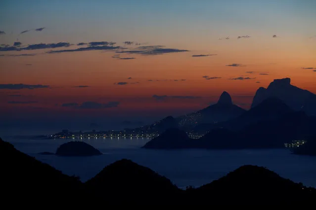 The Rio de Janeiro skyline is pictured during sunset from Niteroi, Brazil, May 31, 2016. (Photo by Ricardo Moraes/Reuters)