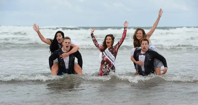 Beach pictures from the Rose of Tralee Internation Festival. Roses on Banna Beach in Co Kerry. Escorts Sean Mulryan Dundalk and Johnny McGailey Galway with Dubai  Ailis Hughes, Luxembourg Niamh Bergin and Sydney Imelda Finnegan enjoy the beach. (Photo by Domnick Walsh/Eye Focus LTD)