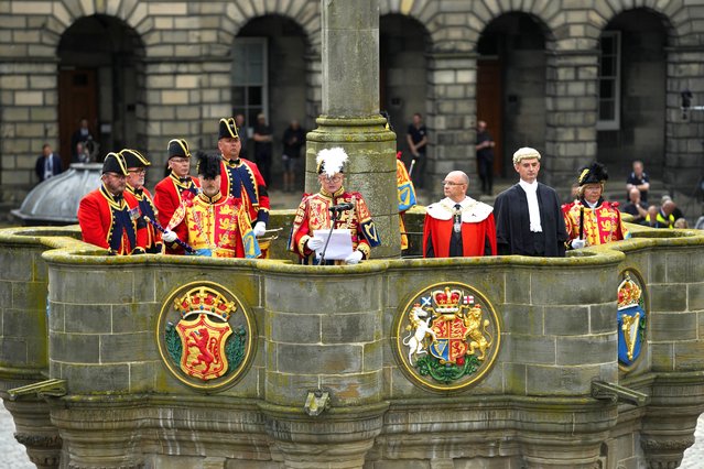 The Lord Lyon King of Arms reads a public Proclamation to the people of Scotland to announce the Accession of King Charles III, outside St Giles Cathedral, on the Royal Mile, in Edinburgh, Scotland, Sunday, September 11, 2022. Queen Elizabeth II, Britain's longest-reigning monarch, died Thursday Sept. 8, 2022, after 70 years on the throne. (Photo by Petr David Josek/AP Photo)