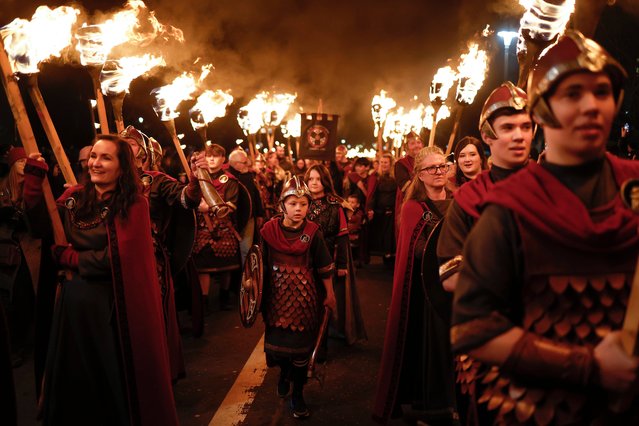 Vikings from Shetland’s South Mainland Up Helly Aa Jarl Squad lead the Torchlight Procession through Edinburgh city centre for the first time since 2019, on December 29, 2023 in Edinburgh, Scotland. Edinburgh's traditional New Year celebrations mark their 30th anniversary this year and run over four days. (Photo by Jeff J. Mitchell/Getty Images)
