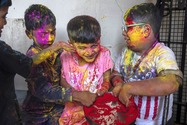 Specially-abled children participate in an early celebration of Holi, the Hindu festival of colors, at their school in Mumbai, India, Wednesday, March 12, 2025. (Photo by Rafiq Maqbool/AP Photo)