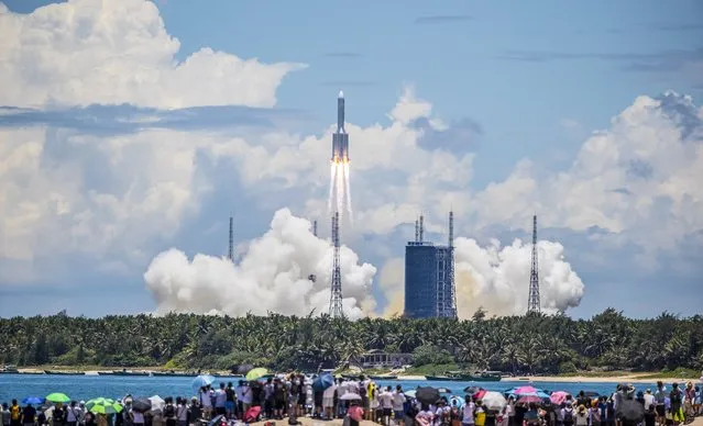 The rocket carrying China's Tianwen-1 Mars rover is seen after liftoff in Wenchang, Hainan province, China, 23 July 2020. The rover was lifted off by a Long March 5 rocket on Hainan Island and it is expected to reach Mars in February 2021. (Photo by EPA/EFE/China Stringer Network)