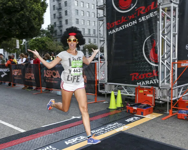 General view of a runner preparing to cross the finish line at the Rock 'n' Roll Los Angeles Halloween Half-Marathon and 5K benefitting the ASPCA, or American Society for the Prevention of Cruelty to Animals on October 26, 2014 in Los Angeles, California. (Photo by Rich Polk/Getty Images for CGI)