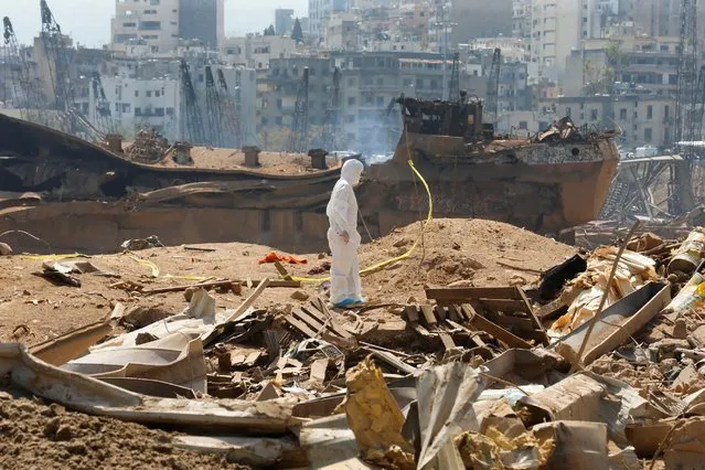 A forensic inspector walks on rubble at the site of Tuesday's blast, at Beirut's port area, Lebanon, August 7, 2020. (Photo by Mohamed Azakir/Reuters)