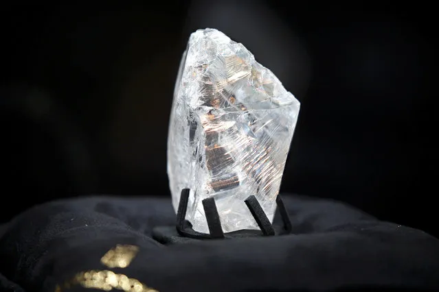 Jewellery company de Grisogono displays the Constellation rough diamond, measuring over six centimetres wide during a news conference in Paris, France, September 9, 2016. De Grisogono purchased for USD63 million The Constellation weighs 813-carats that was discovered by Canadian company, Lucara Diamond, at its Karowe mine in Botswana in November 2015 and presented by the company as the world's most expensive rough diamond. (Photo by Charles Platiau/Reuters)
