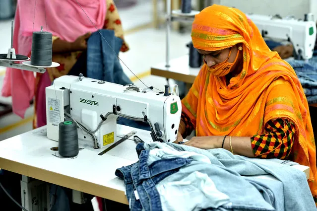 A woman works at a garment factory in Dhaka, Bangladesh, on August 12, 2020. Bangladesh's July export income was over 44 percent higher than that in June, meaning the country's export sector is limping back to normalcy after suffering serious blows owing to COVID-19 impacts. Of the total earnings, the Export Promotion Bureau data showed the country's income from ready-made garment items, including knitwear and woven, stood at 3.24 billion U.S. dollars. (Photo by Xinhua News Agency/Salim via Getty Images)
