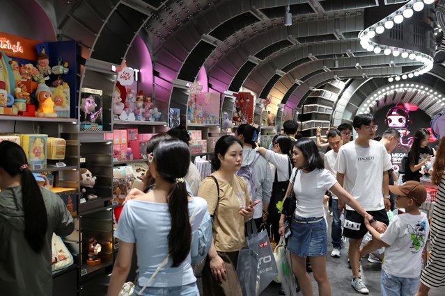 People visit the Pop Mart's flagship store in Shanghai, China on June 13, 2025. (Photo by Go Nakamura/Reuters)