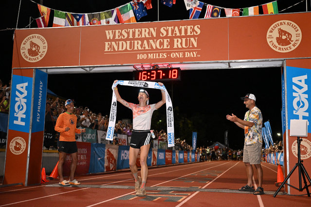 USA's trail runner Abby Hall crosses the finish line to win the women's division of the 2025 Western States Endurance Run with a time of 16:37:16, in Auburn, California on June 28, 2025. The Western States Endurance Run, the world's oldest 100-mile trail race, takes 369 runners from the Olympic Valley valley floor (elevation 6,200 feet) to Emigrant Pass (elevation 8,750 feet), a climb of 2,550 vertical feet in the first 4,5 miles. From the pass, following the original trails used by the gold and silver miners of the 1850's, runners travel west, climbing another 15,540 feet and descending 22,970 feet before reaching Auburn, a small town in the heart of California's historic gold country. Most of the trail passes through remote and rugged territory. (Photo by Robyn Beck/AFP Photo)