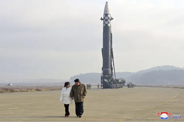 This photo provided on November 19, 2022, by the North Korean government shows North Korean leader Kim Jong Un, right, and his daughter inspect the site of a missile launch at Pyongyang International Airport in Pyongyang, North Korea, Friday, Nov. 18, 2022. North Korea’s state media said its leader Kim oversaw the launch of the Hwasong-17 missile, a day after its neighbors said they had detected the launch of an ICBM potentially capable of reaching the continental U.S. Independent journalists were not given access to cover the event depicted in this image distributed by the North Korean government. The content of this image is as provided and cannot be independently verified. Korean language watermark on image as provided by source reads: “KCNA” which is the abbreviation for Korean Central News Agency. (Photo by Korean Central News Agency/Korea News Service via AP Photo)