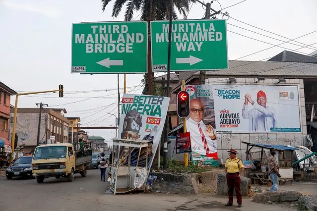 Electoral campaign posters are at a crossroads ahead of Nigeria's presidential election in Lagos, Nigeria on January 31, 2023. (Photo by Temilade Adelaja/Reuters)