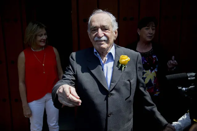 In this March 6, 2014 file photo, Gabriel Garcia Marquez greets fans and reporters outside his home on his birthday in Mexico City. The Colombian Nobel Literature laureate died this year on April 17. His flamboyant and melancholy works outsold everything published in Spanish except the Bible, and he is considered the most popular Spanish-language writer since Miguel de Cervantes in the 17th century. (Photo by Eduardo Verdugo/AP Photo)
