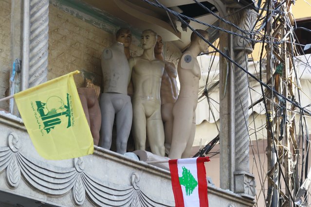 Damaged mannequins are pictured near Lebanese and Hezbollah flags at the site of the two explosions that occurred on Thursday in the southern suburbs of the Lebanese capital Beirut, November 13, 2015. (Photo by Aziz Taher/Reuters)