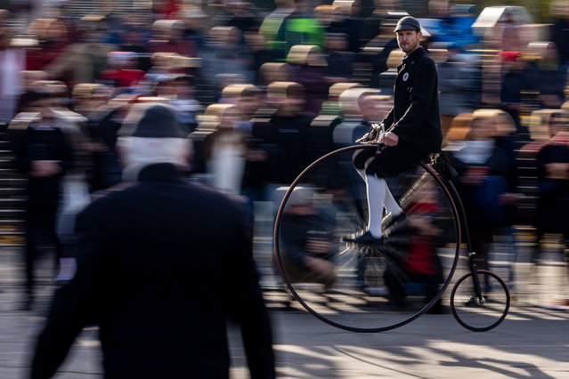 A participant wearing historical attire rides on a high-wheel bicycle during the traditional “Prague Mile” race in Prague, Czech Republic, 01 November 2025. The Czech high-wheel bicycle club was founded in 1880, and its members met for their annual race. (Photo by Martin Divíšek/EPA)