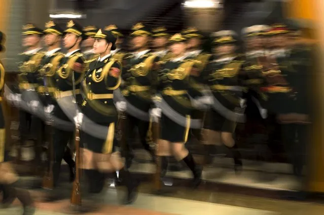 Paramilitary guards arrive prior to the visit of Russian Prime Minister Dmitry Medvedev who meets Chinese Premier Li Keqiang at the Great Hall of the People in Beijing, December 17, 2015. (Photo by Fred Dufour/Reuters)