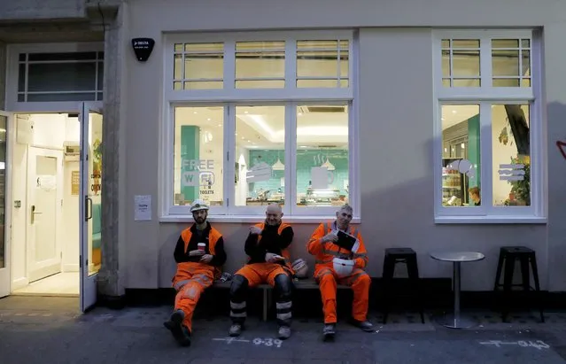 Construction workers take a break at a cafeteria next to the site of the new Crossrail station in Tottenham Court Road, in London, Britain, November 16, 2016. (Photo by Stefan Wermuth/Reuters)