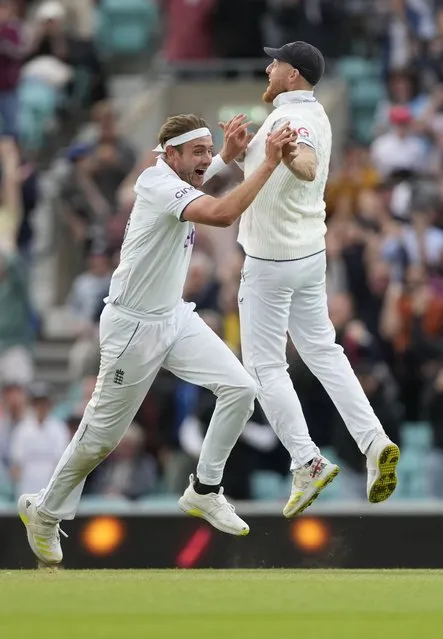 England's Stuart Broad and England's Ben Stokes celebrate the dismissal of Australia's Todd Murphy on day five of the fifth Ashes Test match between England and Australia, at The Oval cricket ground in London, Monday, July 31, 2023. (Photo by Kirsty Wigglesworth/AP Photo)