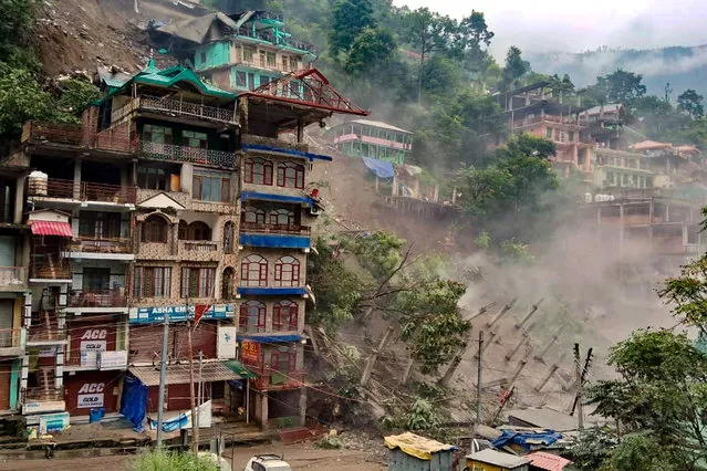 Several buildings collapse after massive landslides following heavy rainfall at Kullu's Anni town, in India's Himachal Pradesh state on August 24, 2023. (Photo by AFP Photo/Stringer)