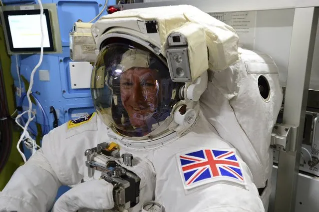 British astronaut Tim Peake poses in his spacesuit aboard the International Space Station on January 11, 2015. Peake became the first astronaut representing Britain to walk in space when he left the International Space Station (ISS) on Friday to fix a power station problem, generating huge interest back in his homeland. (Photo by Reuters/NASA)