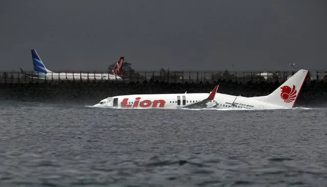 The body of a Lion Air plane is seen in the water after it missed the runway in Denpasar, Bali, in this file picture taken April 13, 2013. (Photo by Reuters/Stringer)