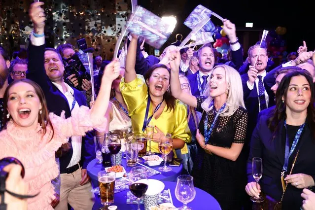Supporters of the Sweden Democrats celebrate at the party's election watch at the Elite Hotel Marina Tower in Nacka, near Stockholm, Sweden, Sunday, September 11, 2022. An exit poll projected that Sweden’s ruling left-wing Social Democrats have won the most votes in a general election while a right-wing populist party had its best showing yet. (Photo by Stefan Jerrevång/TT News Agency via AP Photo)