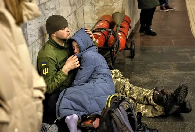 People shelter inside a subway station during a Russian missile attack in Kyiv, Ukraine on March 9, 2023. (Photo by Alina Yarysh/Reuters)
