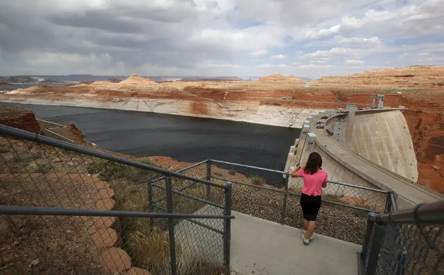 The Glen Canyon Dam can be seen with low water levels of the Colorado River fed Lake Powell outside Page, Arizona, April, 14, 2015. (Photo by Jim Urquhart/Reuters)