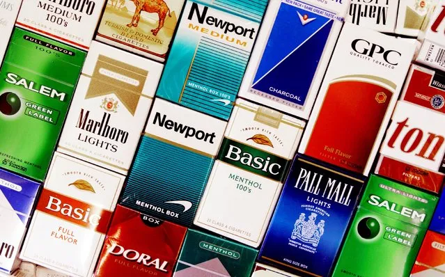 This Wednesday, September 14, 2005 file photo shows cigarette boxes in a store in Brunswick, Maine. On Jan. 11, 1964, U.S. Surgeon General Luther Terry released an emphatic and authoritative report that said smoking causes illness and death – and the government should do something about it. (Photo by Pat Wellenbach/AP Photo)