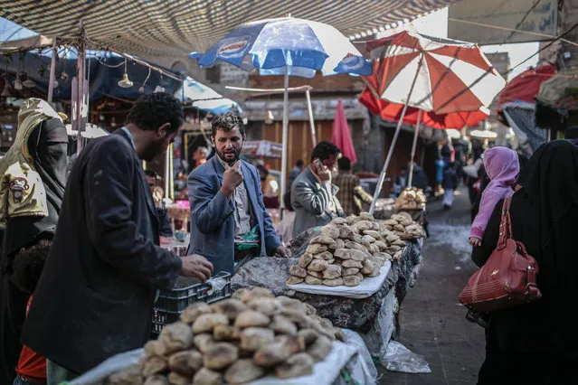 Yemeni street vendors display bread for sale at Souq al-Melh marketplace in the old city of Sanaa, Yemen, Tuesday, December 11, 2018. (Pgoto by Hani Mohammed/AP Photo)