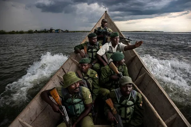 Documentary and photojournalism – honourable mention – Virunga. Rangers patrol Lake Edward in the Democratic Republic of Congo. There are regular patrols as well as intelligence-gathering, owing to incursions by Mai Mai militia groups on the lake, which was once the home of the largest hippopotamus population in the world. The hippos are central to the wellbeing of the lake ecosystem, but their numbers have been decimated by decades of fighting in the region. (Photo by Brent Stirton/SIPA Contest)
