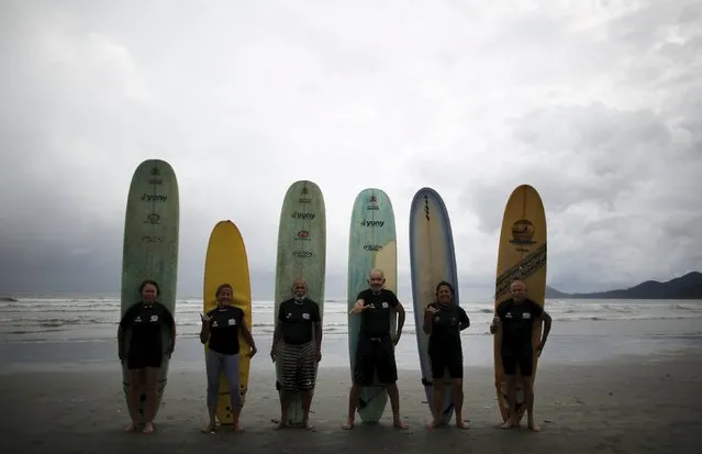 (R-L) Sueli garcia, 60, Elsa Rodrigues, 61, Osmidio Conde, 71,  Simplicio Zaninete, 65, Edmea Pereira, 69, and her husband Francisco Aguiar, 71, pose for a picture after their school's surf class in Santos, Sao Paulo state, Brazil, March 16, 2016. (Photo by Nacho Doce/Reuters)