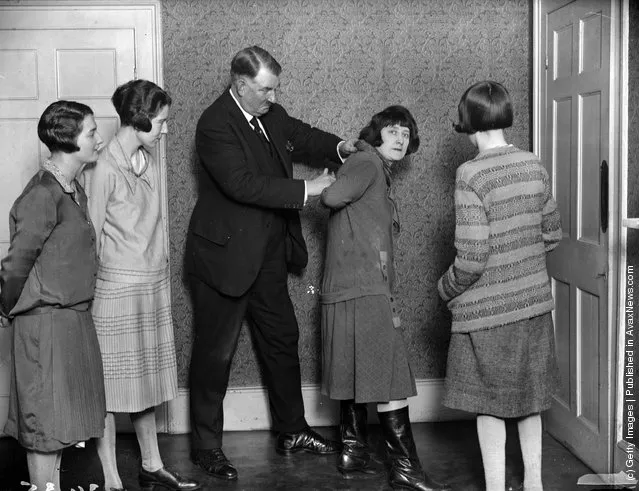 April 1927:  Lady detectives learning their trade. Mr Kersey is showing them how to apprehend a suspect