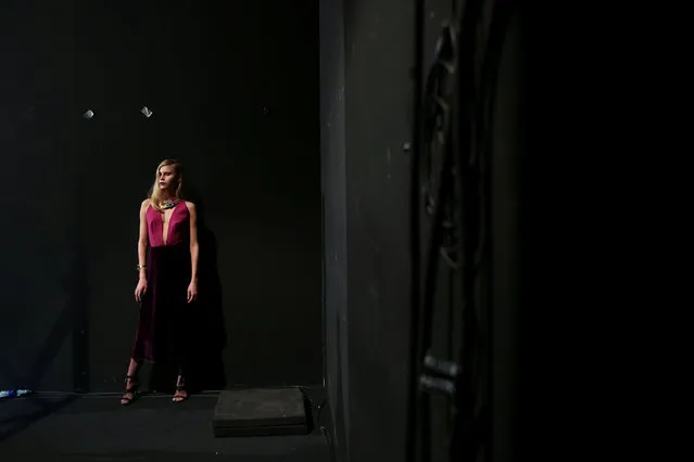 A model presenting a creation from Esther Noriega's Fall/Winter 2017 collection poses for a photographer during the Mercedes-Benz Fashion Week in Madrid, Spain February 20, 2017. (Photo by Susana Vera/Reuters)