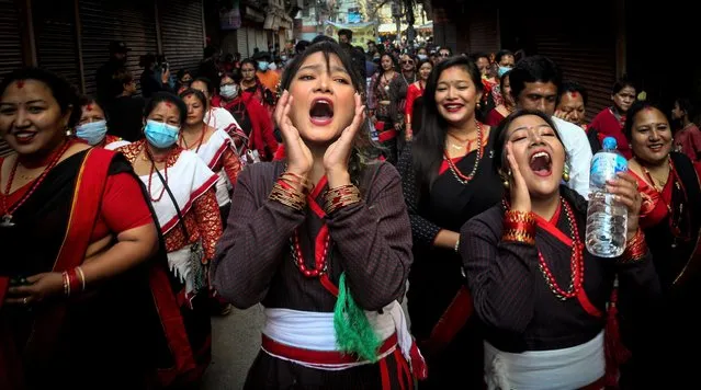Women from ethnic Newar community gesture during a cultural rally in celebration of the New Year 1142 of Nepal Sambat in Kathmandu on November 5, 2021. Nepal Sambat, founded by Shankhadhar Sakhwa, is a national lunar calendar of Nepal which begins every year on “Mha Puja”, the fourth day of Tihar festival. (Photo by Sunil Sharma/ZUMA Press Wire/Rex Features/Shutterstock)